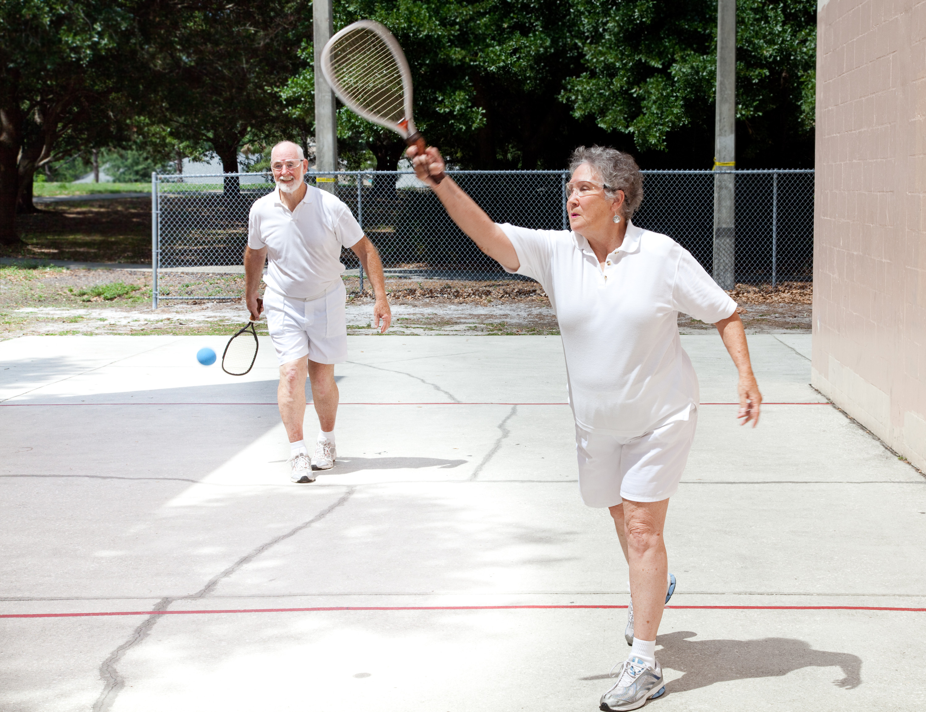 Older adults playing racquetball